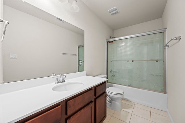 5406 Traviston Dr, Austin, TX 78738 - bathroom featuring toilet, vanity, tile patterned flooring, and enclosed tub / shower combo