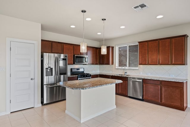 5406 Traviston Dr, Austin, TX 78738 - kitchen with appliances with stainless steel finishes, a sink, backsplash, light stone counters, and decorative light fixtures