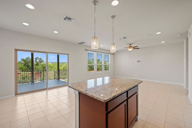 5406 Traviston Dr, Austin, TX 78738 - kitchen featuring open floor plan, recessed lighting, hanging light fixtures, light tile patterned floors, and a center island