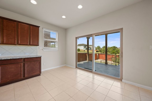 5406 Traviston Dr, Austin, TX 78738 - unfurnished dining area with baseboards and recessed lighting