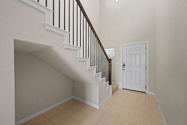 5406 Traviston Dr, Austin, TX 78738 - tiled foyer entrance with stairway, baseboards, and a high ceiling