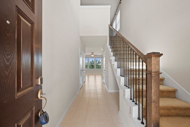 5406 Traviston Dr, Austin, TX 78738 - entrance foyer with baseboards, stairs, light tile patterned floors, and ceiling fan