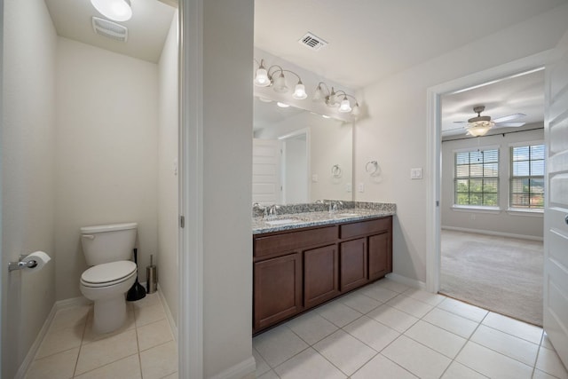 5406 Traviston Dr, Austin, TX 78738 - full bathroom featuring tile patterned floors, double vanity, toilet, and baseboards