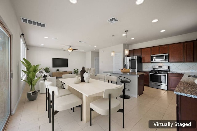 5406 Traviston Dr, Austin, TX 78738 - dining space with recessed lighting, ceiling fan, and light tile patterned floors