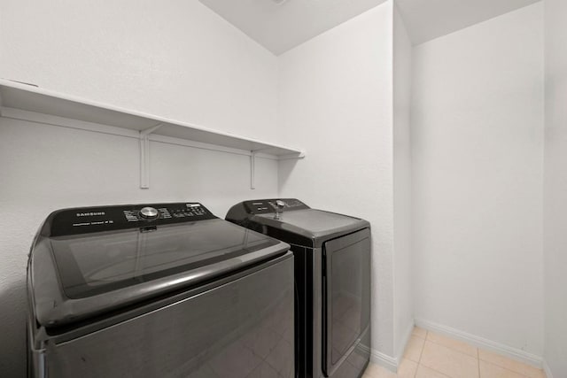 5406 Traviston Dr, Austin, TX 78738 - laundry area with separate washer and dryer, baseboards, and light tile patterned flooring