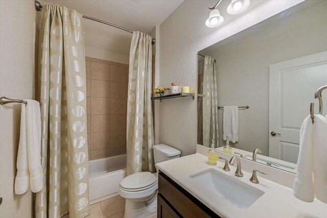 9424 Sawyer Fay Ln, Austin, TX 78748 - bathroom with shower / bath combo with shower curtain, vanity, toilet, and tile patterned floors