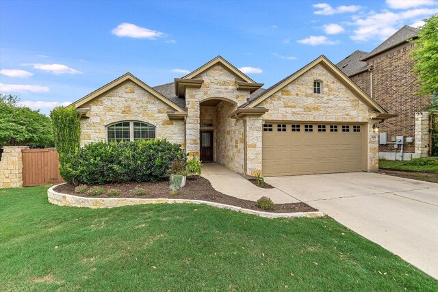 9424 Sawyer Fay Ln, Austin, TX 78748 - french country inspired facade with stone siding, a garage, and concrete driveway