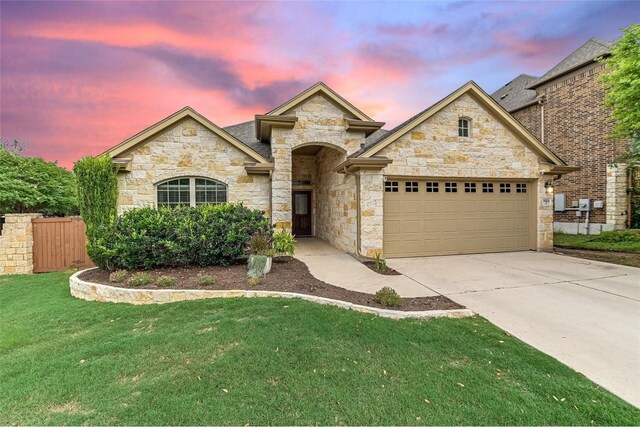 9424 Sawyer Fay Ln, Austin, TX 78748 - french country style house with stone siding, an attached garage, and concrete driveway