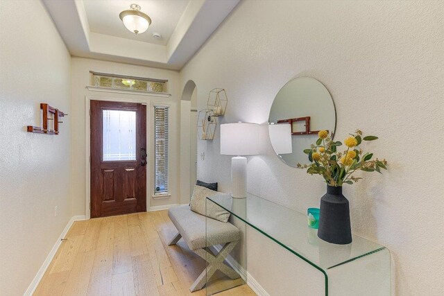 9424 Sawyer Fay Ln, Austin, TX 78748 - foyer with hardwood / wood-style flooring, arched walkways, and baseboards