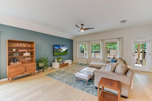 9424 Sawyer Fay Ln, Austin, TX 78748 - living room with wood finished floors, a ceiling fan, healthy amount of natural light, and baseboards
