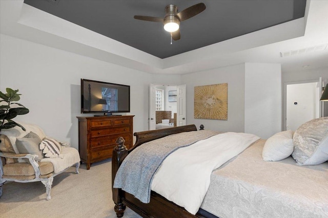 12501 Bright Sky Overlook, Austin, TX 78732 - bedroom featuring a raised ceiling, light carpet, and ceiling fan