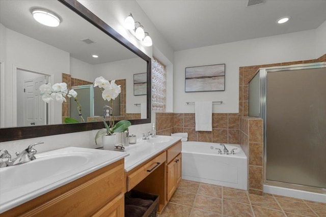 12501 Bright Sky Overlook, Austin, TX 78732 - bathroom featuring double vanity, a stall shower, a bath, and tile patterned flooring