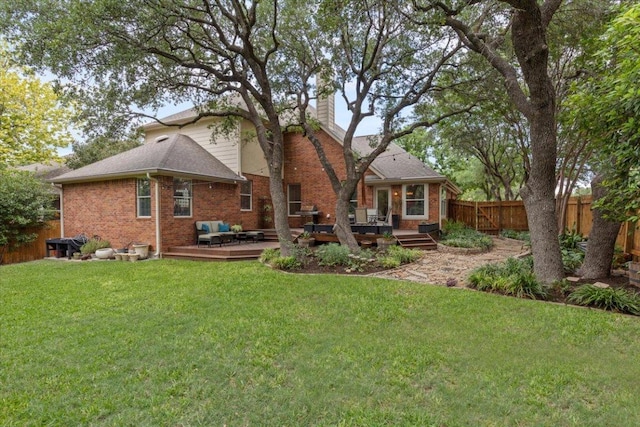 12501 Bright Sky Overlook, Austin, TX 78732 - rear view of house with a fenced backyard, a deck, a chimney, and brick siding