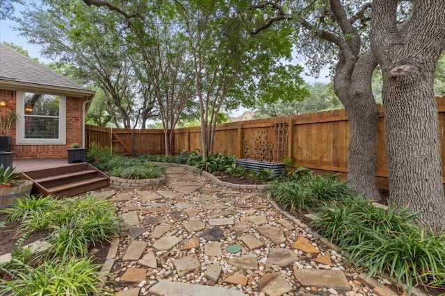 12501 Bright Sky Overlook, Austin, TX 78732 - fenced backyard with a patio and a wooden deck