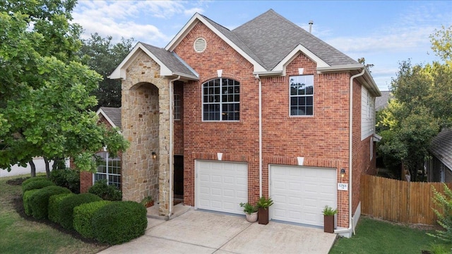 12501 Bright Sky Overlook, Austin, TX 78732 - traditional-style house with a garage, driveway, brick siding, and a shingled roof