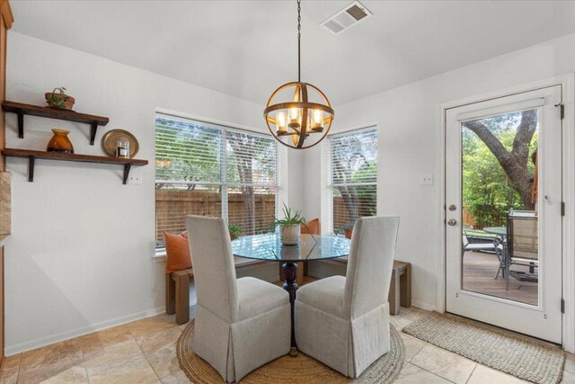 12501 Bright Sky Overlook, Austin, TX 78732 - dining space featuring a chandelier and light tile patterned flooring
