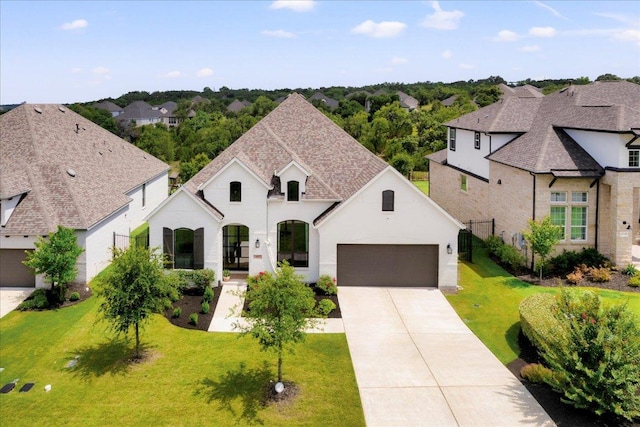 482 Running Bird Rd, Austin, TX 78737 - french provincial home with a garage, driveway, stucco siding, and a residential view