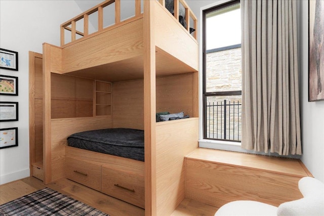 482 Running Bird Rd, Austin, TX 78737 - bedroom with wood finished floors and multiple windows