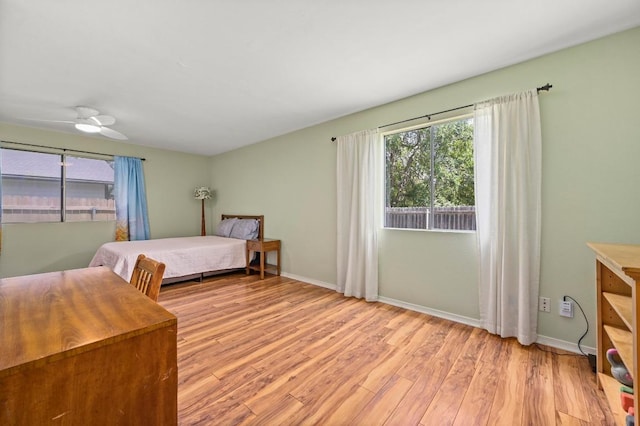 3921 Leafield Dr, Austin, TX 78749 - bedroom featuring light wood-style floors, baseboards, and ceiling fan