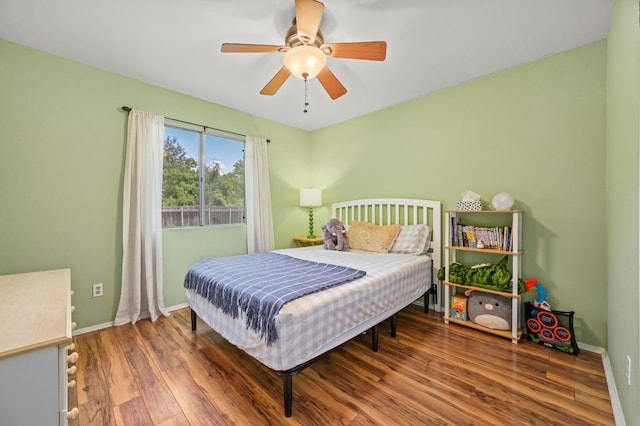 3921 Leafield Dr, Austin, TX 78749 - bedroom featuring wood finished floors, baseboards, and ceiling fan
