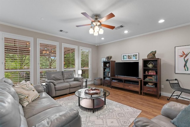 2125 Village View Loop, Pflugerville, TX 78660 - living area featuring ceiling fan, wood finished floors, crown molding, recessed lighting, and baseboards