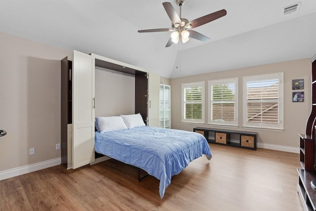 2125 Village View Loop, Pflugerville, TX 78660 - bedroom featuring light wood finished floors, baseboards, lofted ceiling, and a ceiling fan
