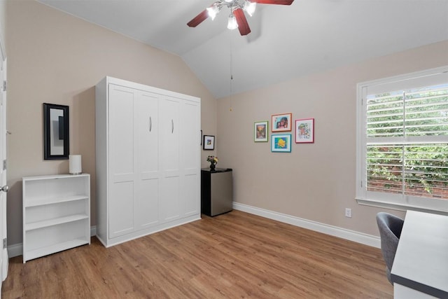 2125 Village View Loop, Pflugerville, TX 78660 - bedroom with light wood-type flooring, baseboards, vaulted ceiling, a closet, and a ceiling fan