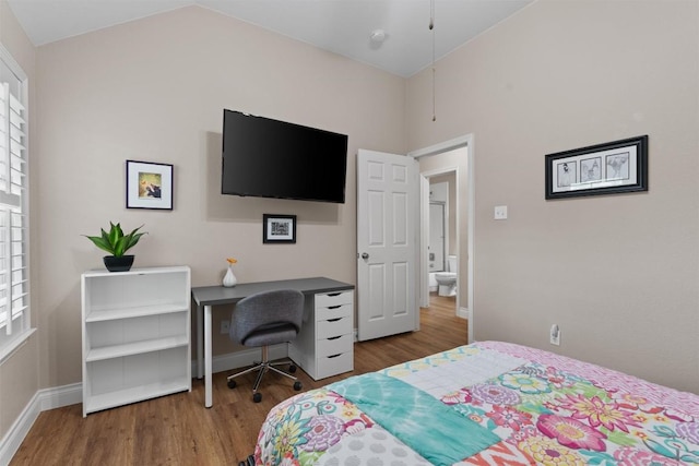 2125 Village View Loop, Pflugerville, TX 78660 - bedroom featuring wood finished floors, lofted ceiling, and baseboards