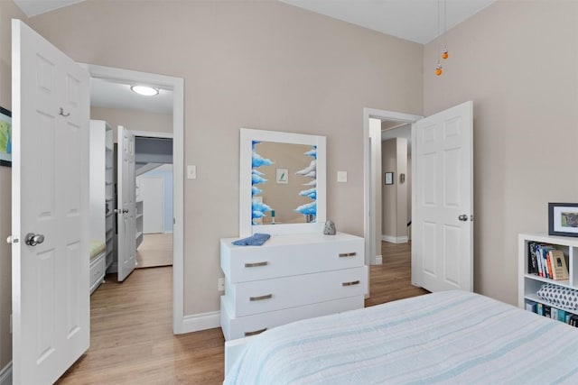 2125 Village View Loop, Pflugerville, TX 78660 - bedroom with wood finished floors, baseboards, and attic access