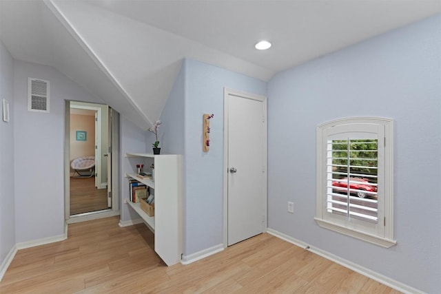 2125 Village View Loop, Pflugerville, TX 78660 - hallway featuring light wood finished floors, baseboards, and lofted ceiling