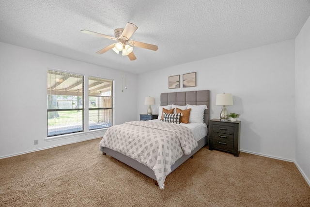 11512 Tin Cup Dr Unit 103, Austin, TX 78750 - bedroom featuring carpet floors, a textured ceiling, a ceiling fan, and baseboards