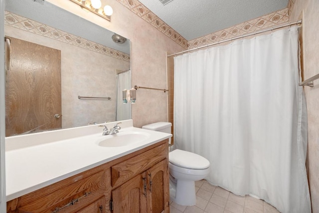 11512 Tin Cup Dr Unit 103, Austin, TX 78750 - full bathroom with toilet, vanity, tile patterned floors, a textured ceiling, and a shower with curtain