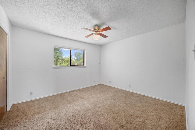 11512 Tin Cup Dr Unit 103, Austin, TX 78750 - carpeted empty room featuring a ceiling fan, a textured ceiling, and baseboards