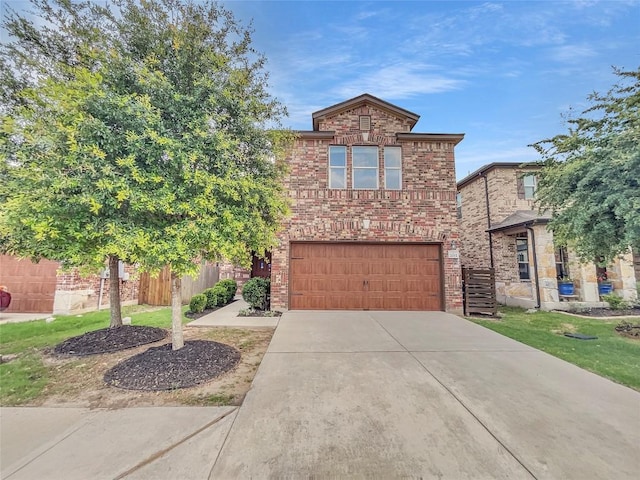 2015 Split Diamond Way, Round Rock, TX 78664 - traditional-style house featuring driveway, a garage, and brick siding