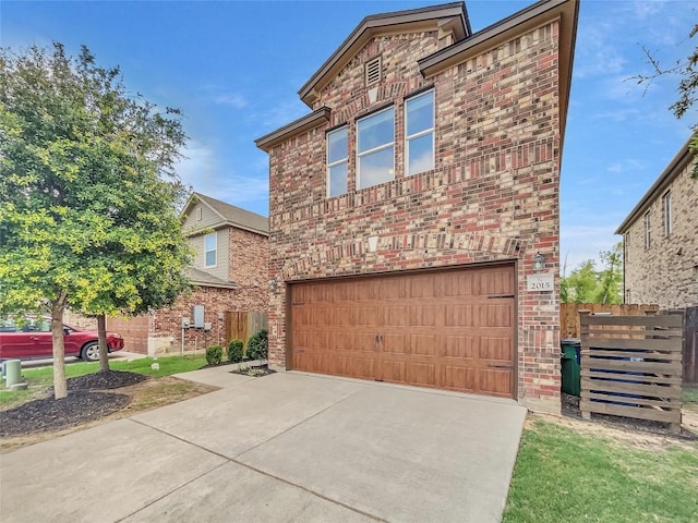 2015 Split Diamond Way, Round Rock, TX 78664 - view of front facade featuring a garage, brick siding, and concrete driveway