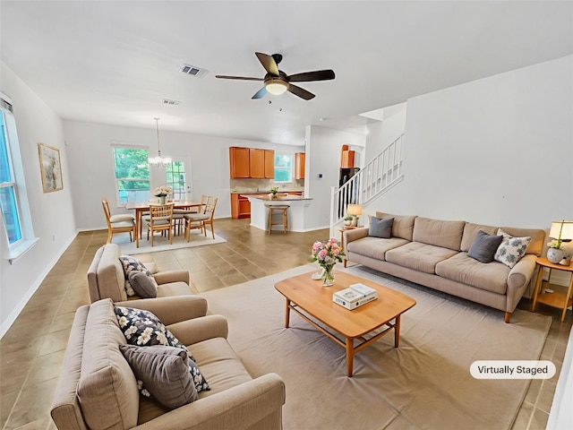 2015 Split Diamond Way, Round Rock, TX 78664 - living room featuring ceiling fan, stairs, and baseboards