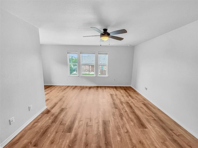 2015 Split Diamond Way, Round Rock, TX 78664 - unfurnished room featuring light wood finished floors, a ceiling fan, and baseboards