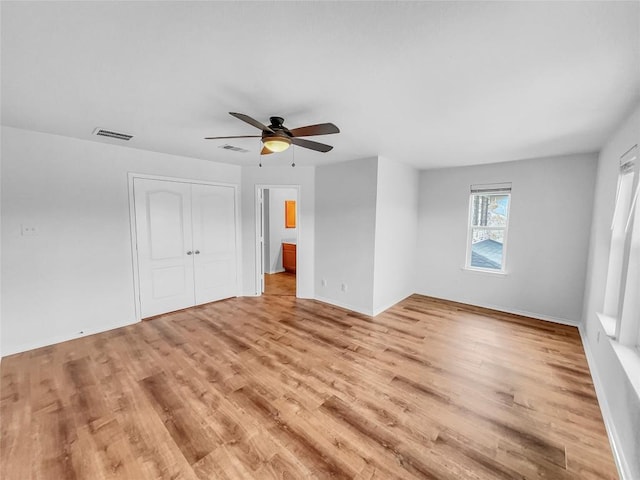 2015 Split Diamond Way, Round Rock, TX 78664 - unfurnished bedroom featuring light wood finished floors, a closet, ceiling fan, and baseboards