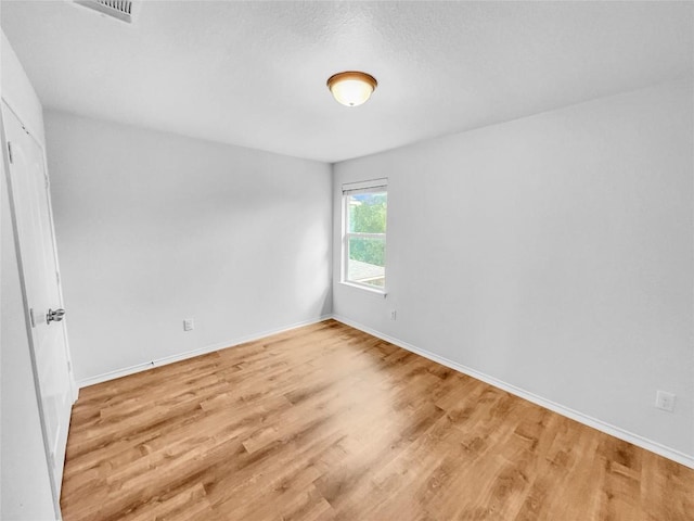 2015 Split Diamond Way, Round Rock, TX 78664 - unfurnished room with wood finished floors and baseboards