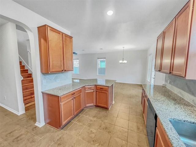 2015 Split Diamond Way, Round Rock, TX 78664 - kitchen featuring dishwashing machine, a peninsula, a chandelier, arched walkways, and light stone countertops