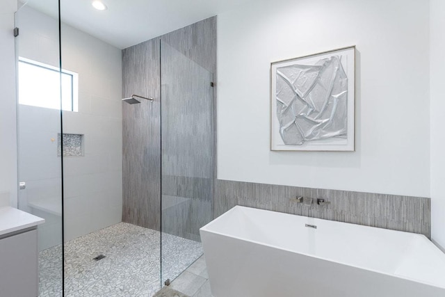 2601 Great Owl Pass, Leander, TX 78641 - full bath featuring a freestanding bath, a walk in shower, tile patterned flooring, recessed lighting, and vanity