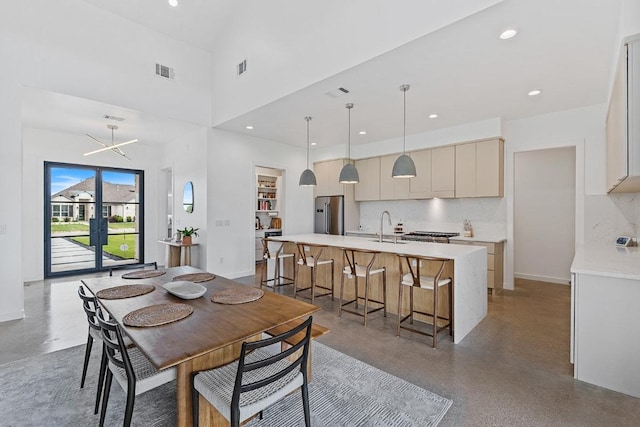 2601 Great Owl Pass, Leander, TX 78641 - dining area with a towering ceiling and recessed lighting