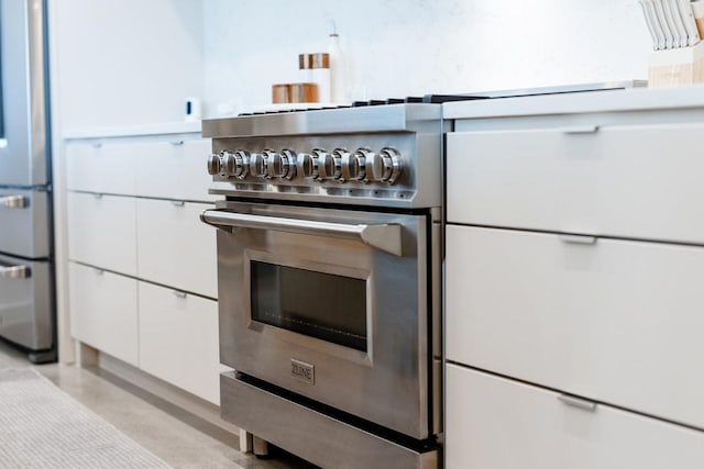 2601 Great Owl Pass, Leander, TX 78641 - kitchen featuring white cabinets and appliances with stainless steel finishes