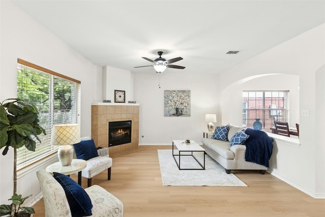 1113 Red Ranch Cir, Cedar Park, TX 78613 - living area with plenty of natural light, light wood finished floors, and a tile fireplace