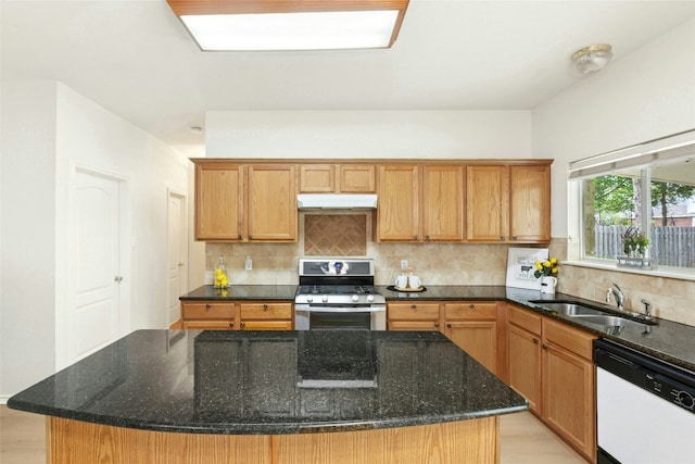 1113 Red Ranch Cir, Cedar Park, TX 78613 - kitchen featuring white dishwasher, stainless steel range with gas stovetop, under cabinet range hood, a sink, and tasteful backsplash