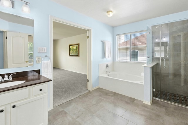 1113 Red Ranch Cir, Cedar Park, TX 78613 - full bath with vanity, a garden tub, a stall shower, and baseboards