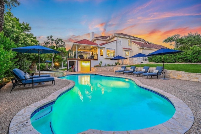 22 Wingreen Loop, The Hills, TX 78738 - view of pool featuring a patio area, a pool with connected hot tub, and a ceiling fan