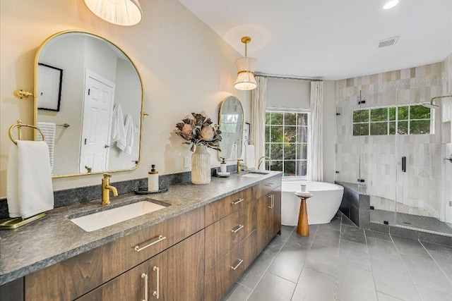 22 Wingreen Loop, The Hills, TX 78738 - bathroom featuring a shower stall, double vanity, a freestanding bath, and recessed lighting