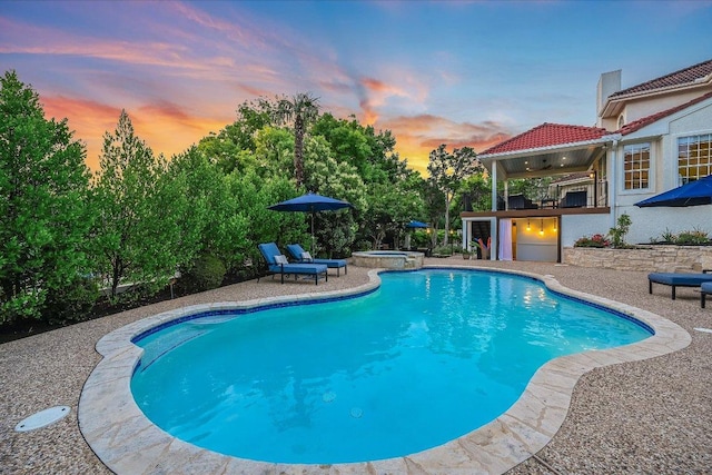 22 Wingreen Loop, The Hills, TX 78738 - view of swimming pool featuring a patio area and a pool with connected hot tub