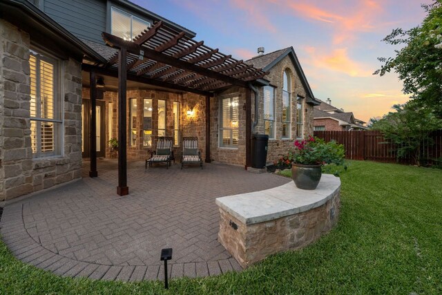 3022 Luminoso Ln E, Round Rock, TX 78681 - patio terrace at dusk featuring a pergola and a patio area